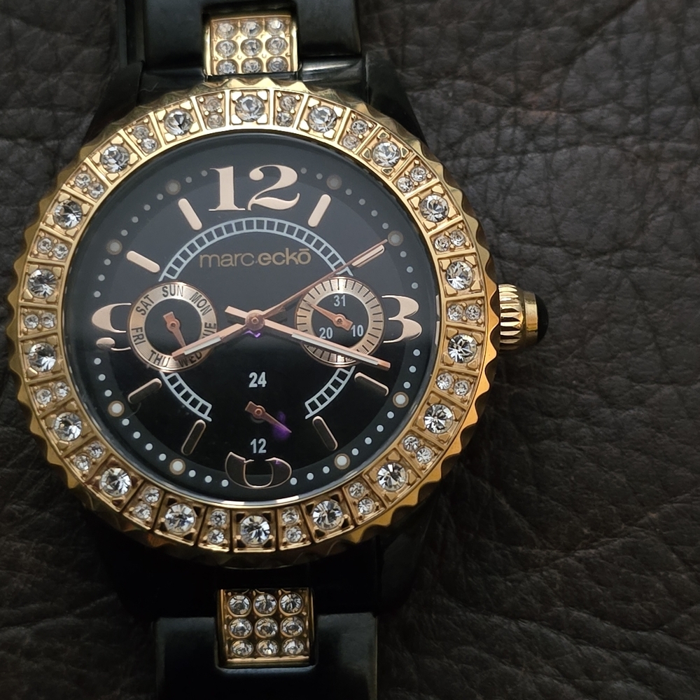 Marc Ecko womens E17536L1 black and gold with gem accents. Stainless steel